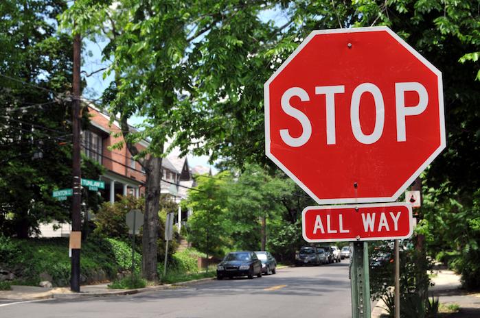 Stop Sign with Cars in Background