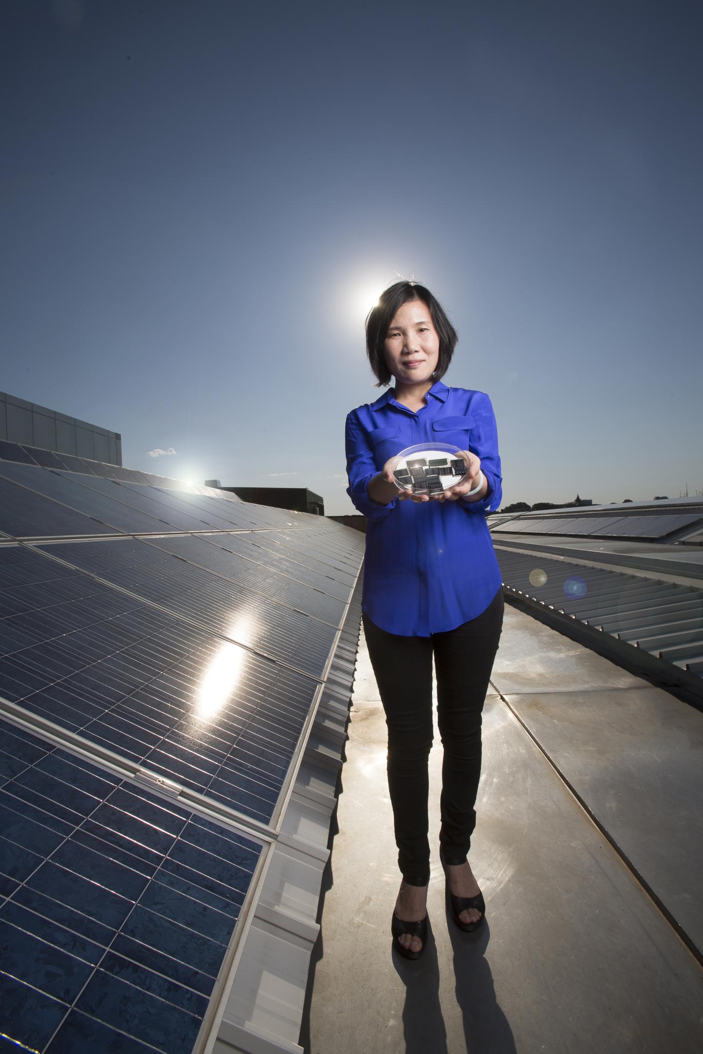 Xiaojing Hao with CZTS solar cells, University of News South Wales