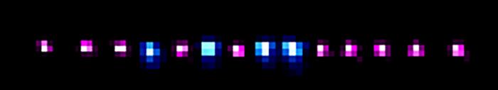 A crystal consisting of indium (pink) and ytterbium (blue) ions