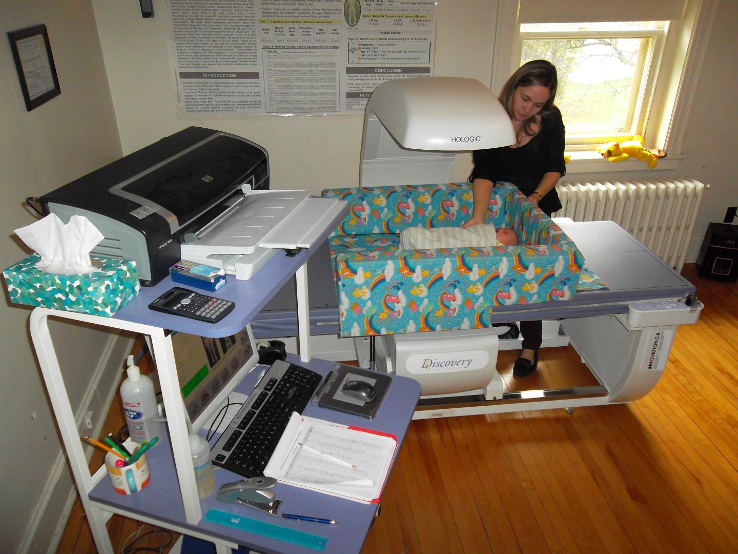 Research Nurse Setting up the Equipment to Measure Infant Muscle and Bone