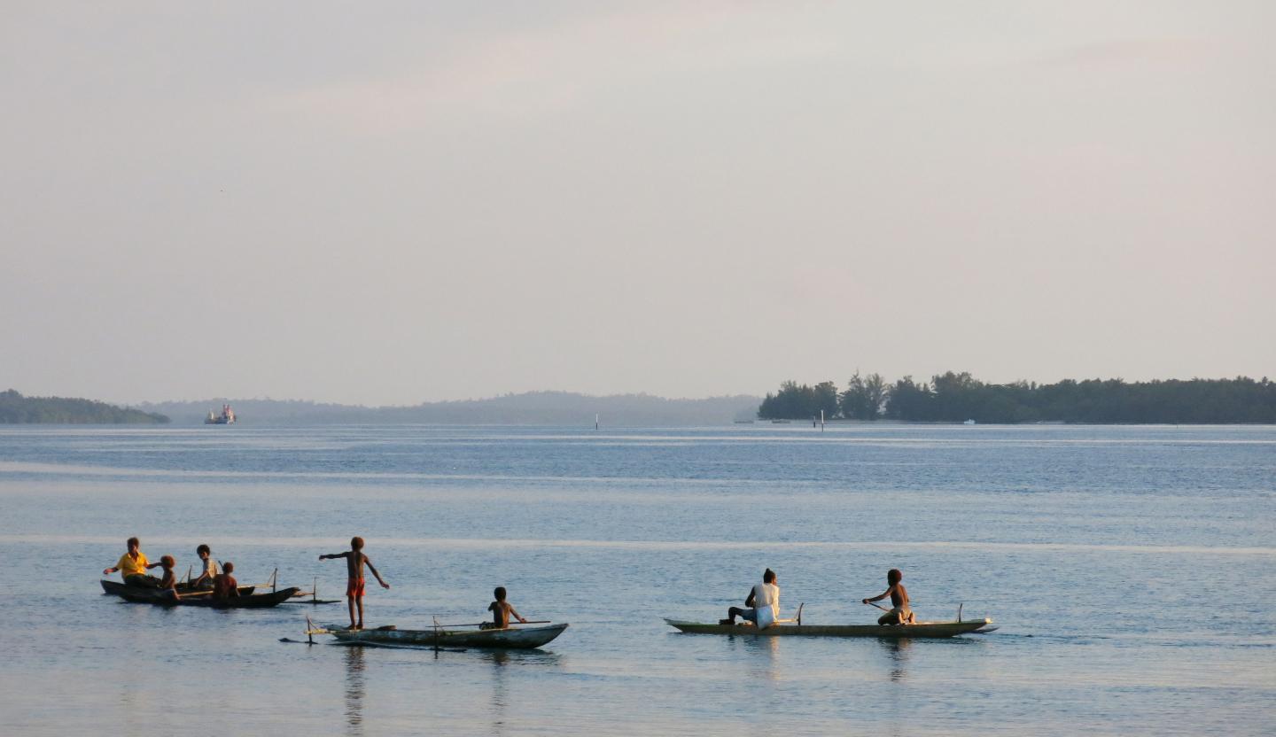 Mother and Children Fishing in Papua New Guinea