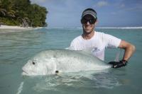 Ryan Daly releasing a tagged giant trevally