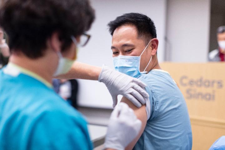 Cedars-Sinai employee receives his COVID-19 vaccine.