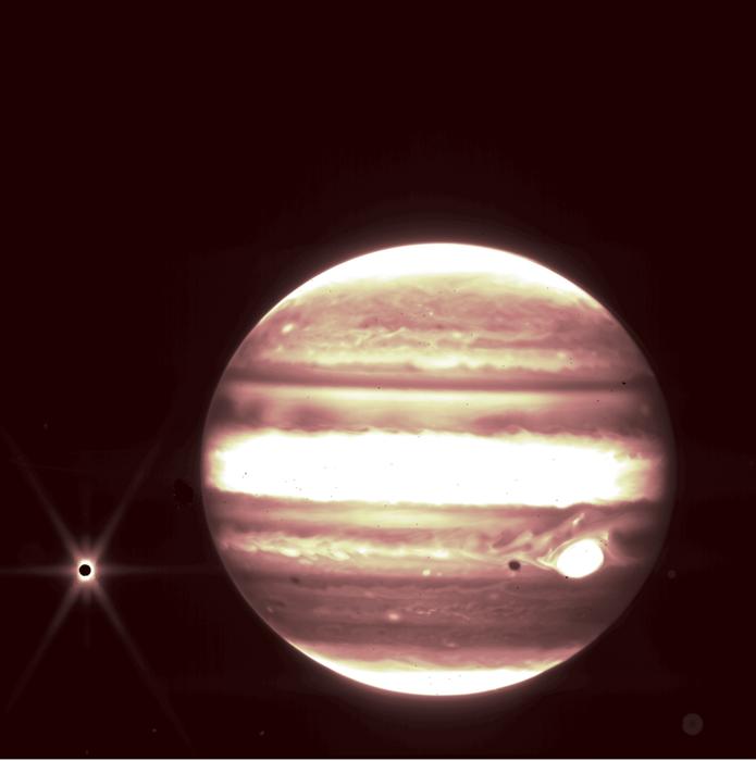 Webb views Jupiter, center, and its moon Europa