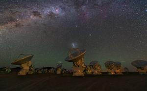 A group of ALMA 12-m antennas observing the night sky