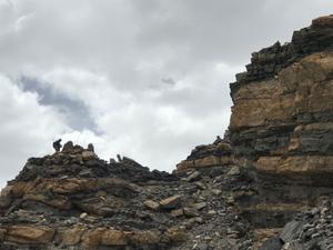 A geologist collects magma samples in a field campaign over the Tibetan Plateau.