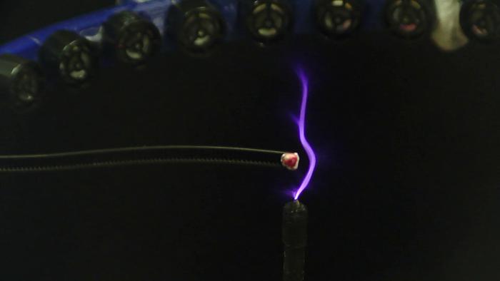 Making an invisible electric wire: guiding electricity with sound