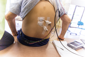 A research participant prepared for transcutaneous stimulation of the spinal cord