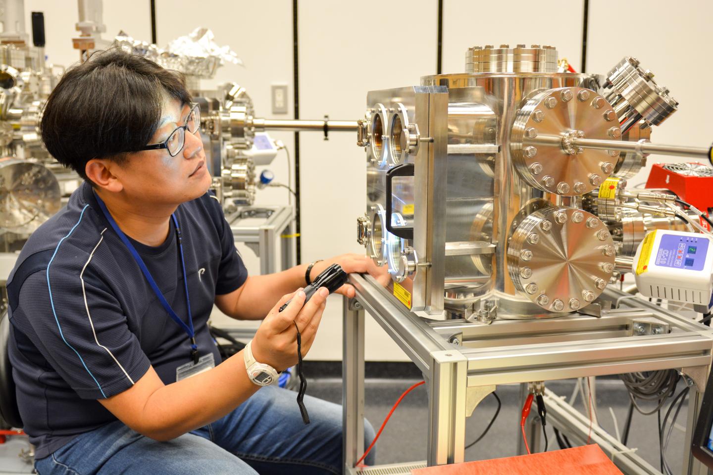 Min-Cherl Jung Monitors Vacuum Evaporation Process