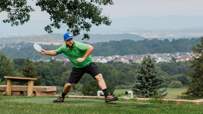 Action shot of a person throwing a disc