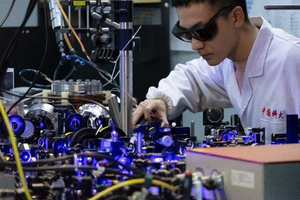 The Ph.D. student SUN Weiwei in Prof. Lu’s group operating the laser system to manipulate and capture the atoms (Image by Prof. LU’s team)