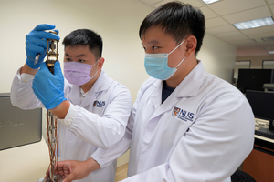 Aaron Tieu Jue Kang, Research Engineer, and Research Fellow Zeyu Deng, loading of the NASICON  in the low-temperature probe