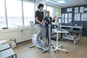 Dr. Roger Zemek with concussion patient on bike