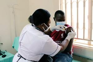 First enrolled volunteer to the PrEPVacc clinical trial receiving an injection