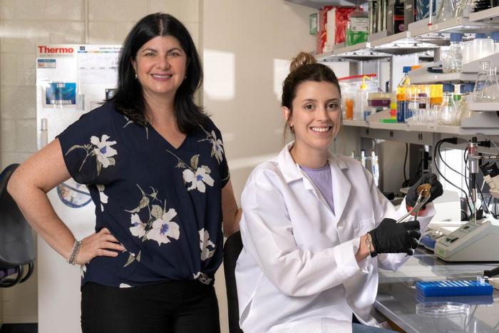 Biology professor Laura Mydlarz with then graduate student Kelsey Beavers