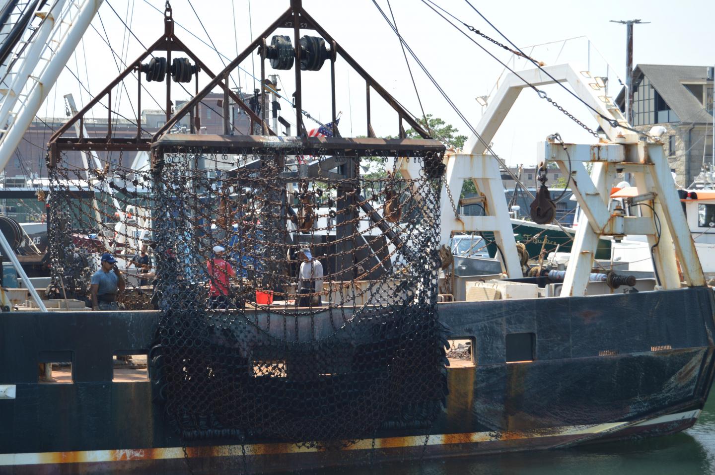 A commercial fishing boat and a group of fishermen, New Bedford, MA, USA