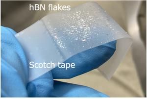Hexagonal boron nitride flakes peeled by scotch tape.