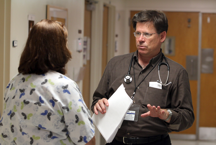 Medical University of South Carolina pulmonologist Dr. Patrick Flume speaks with a colleague