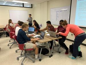 Students in Cayelan Carey's class are working on the Macrosystems EDDIE modules with assistance from Mary Lofton (at far right).