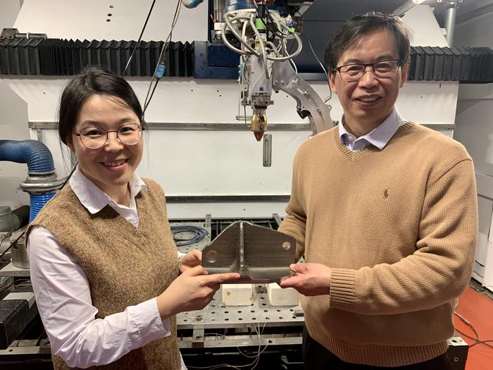 Researchers with 3D-printed titanium alloy