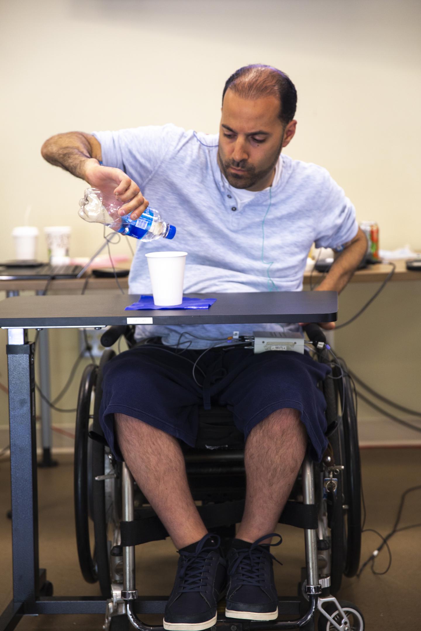 Demonstration of spinal cord transcutaneous stimulation combined with hand training