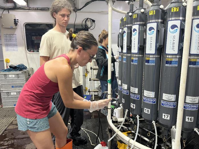 Members of the expedition prepare the equipment to take samples.