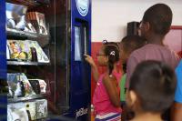 Students Waiting in Book Vending Machine Line