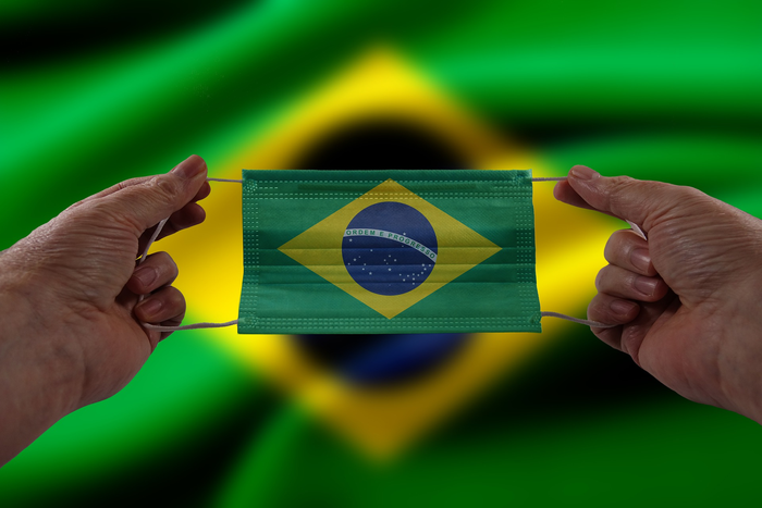 A face mask with the Brazilian flag on it.