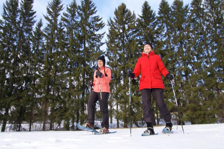 Two Women Walking on Snowshoes