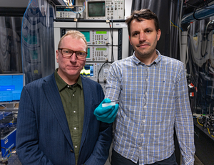 Dr Andy Boes and Distinguished Professor Arnan Mitchell with a photonic chip