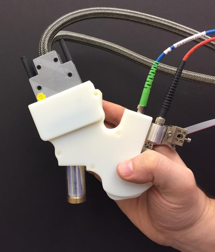 Handheld Adaptive Optics Scanning Laser Ophthalmoscope