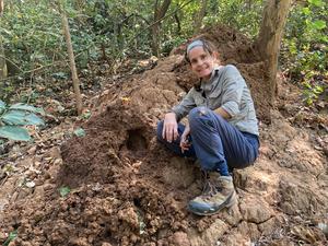 Dr Alejandra Pascual-Garrido at a termite mound