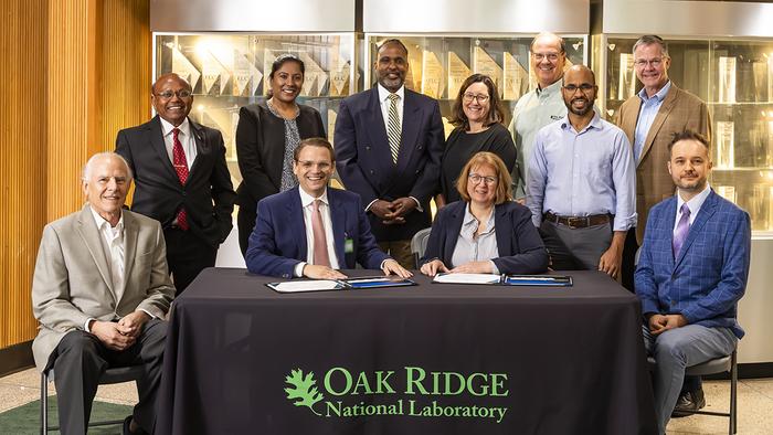 Seated, from left to right, are Bruce Moyer, ORNL corporate fellow; Hood Whitson, Element3 CEO