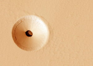 A crater on Mars reveals a pit underneath