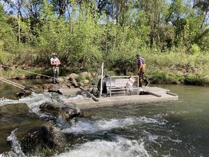 Installing fish trap on creek