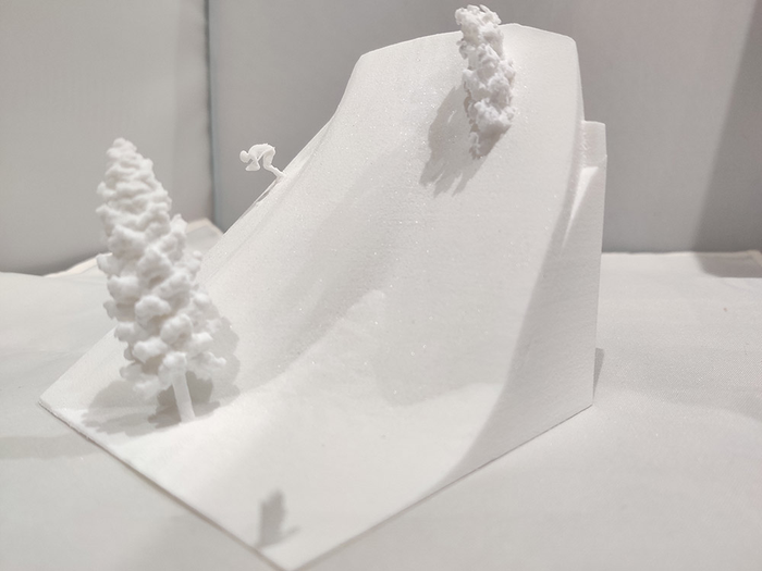 Close up of 3D printed snow scene with skier