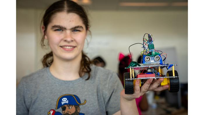 Camper Emily Boyd displays the vehicle her team built