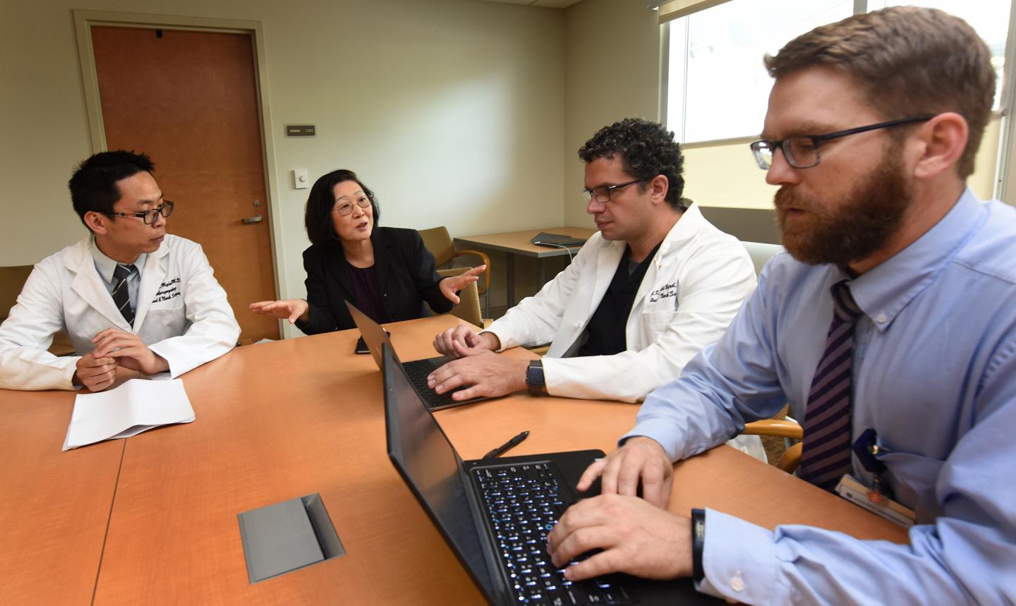 Resident Dr. Calvin Myint, Immunologist Dr. Yan Cui and Otolaryngologists Drs. J. Kenneth Byrd and Michael Groves