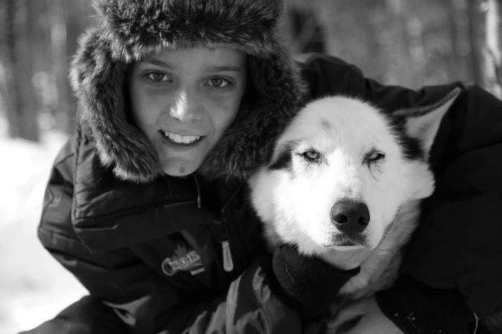 Young Patient Bonds with Sled Dog
