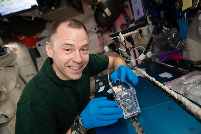 NASA astronaut Nick Hague runs an analysis with the miniPCR hardware for Genes in Space-6 during Expedition 59.