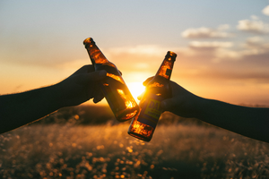 Two people drinking alcohol.