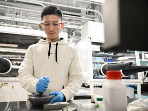 Student prepares a sample for cold sintering