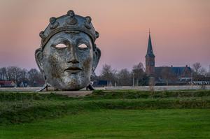 Nijmegen, The Netherlands, 17.12.2023, Sculpture of Roman mask "Het gezicht van Nijmegen" by artist Andreas Hetfeld, located on the banks of river Waal