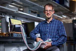 Steven Hall in a laboratory with equipment that gathers nitrous oxide smaples