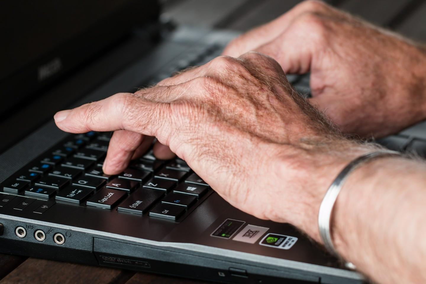 Hands at a computer