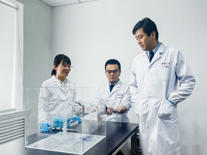 Investigators assessed mosquito behavioral response by a two-port olfactometer assay (Left to right Dr. Hong Zhang, Dr. Yibin Zhu, Prof. Gong Cheng)