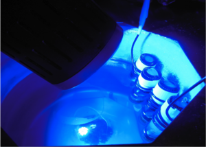 Reaction vials being exposed to blue light from an LED