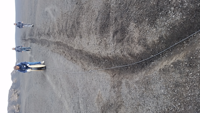 Deployment of the fibre optic cable in the scoria layer at Etna volcano summit