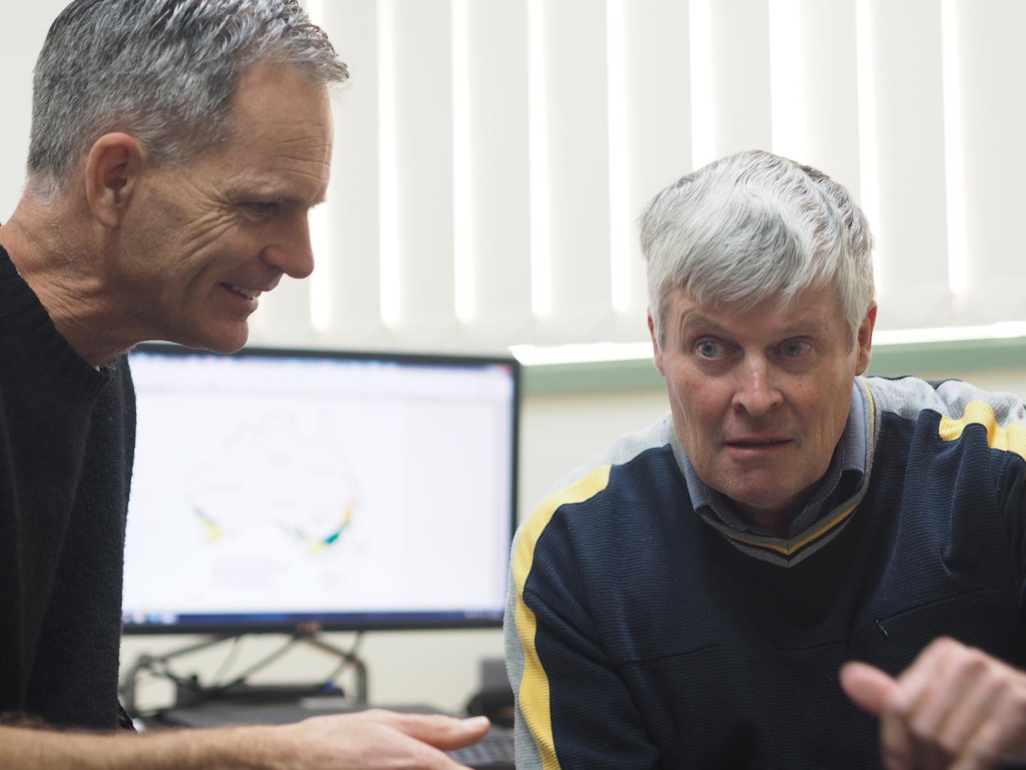 Researchers with Computer Model