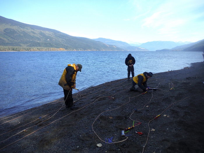 Researchers assembling a mooring rope with sensors,